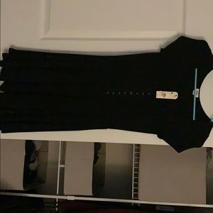 Little black dress, short sleeved and never worn!
